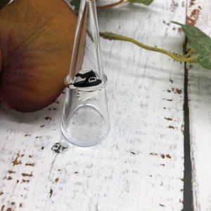 Shiny silver witch hat and broom ring